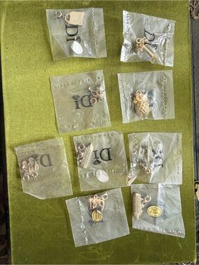 9 DI charms new in bags